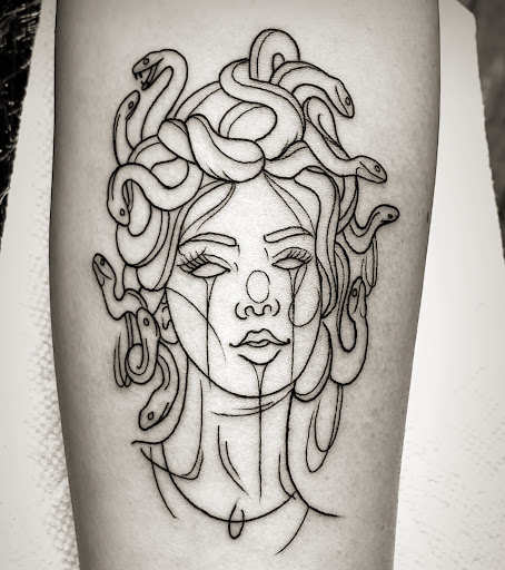 Explore above the knee tattoo ideas, creative tattoo ideas in Lakeland, available at Black Swan Tattoo