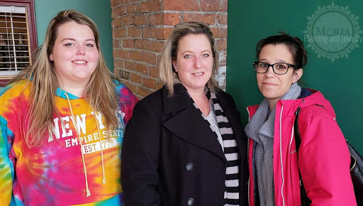 Explore tattoo ideas for mens leg, creative tattoo ideas in Buffalo, available at Moria Piercing and Jewelry