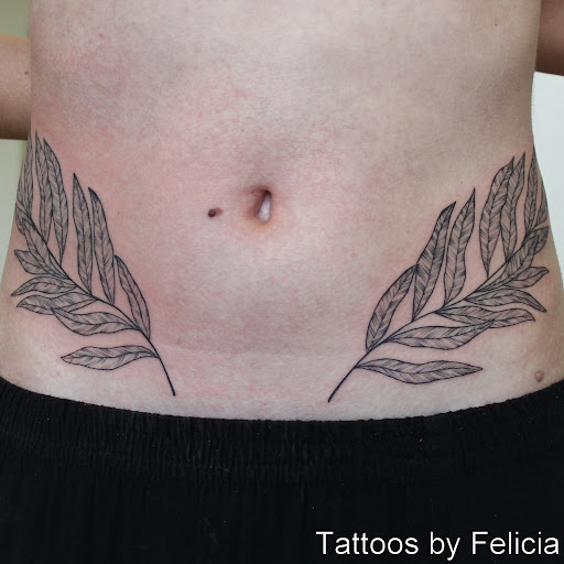 Find rib tattoo ideas for females for your next unique tattoo in Fort Myers at Tiger Lotus Tattoo and Piercing