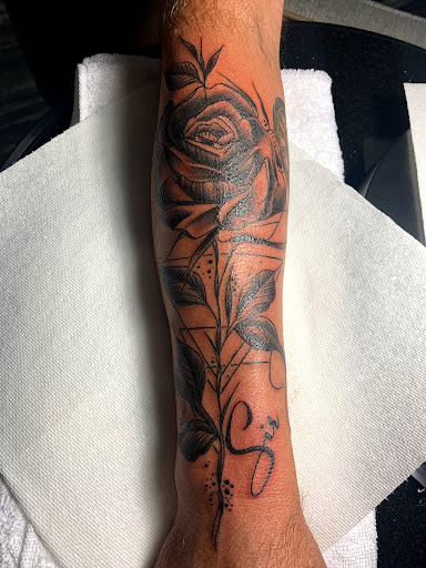 Explore tattoo cover up ideas for upper back, creative tattoo ideas in Cape Coral, available at UNRIVALED INK