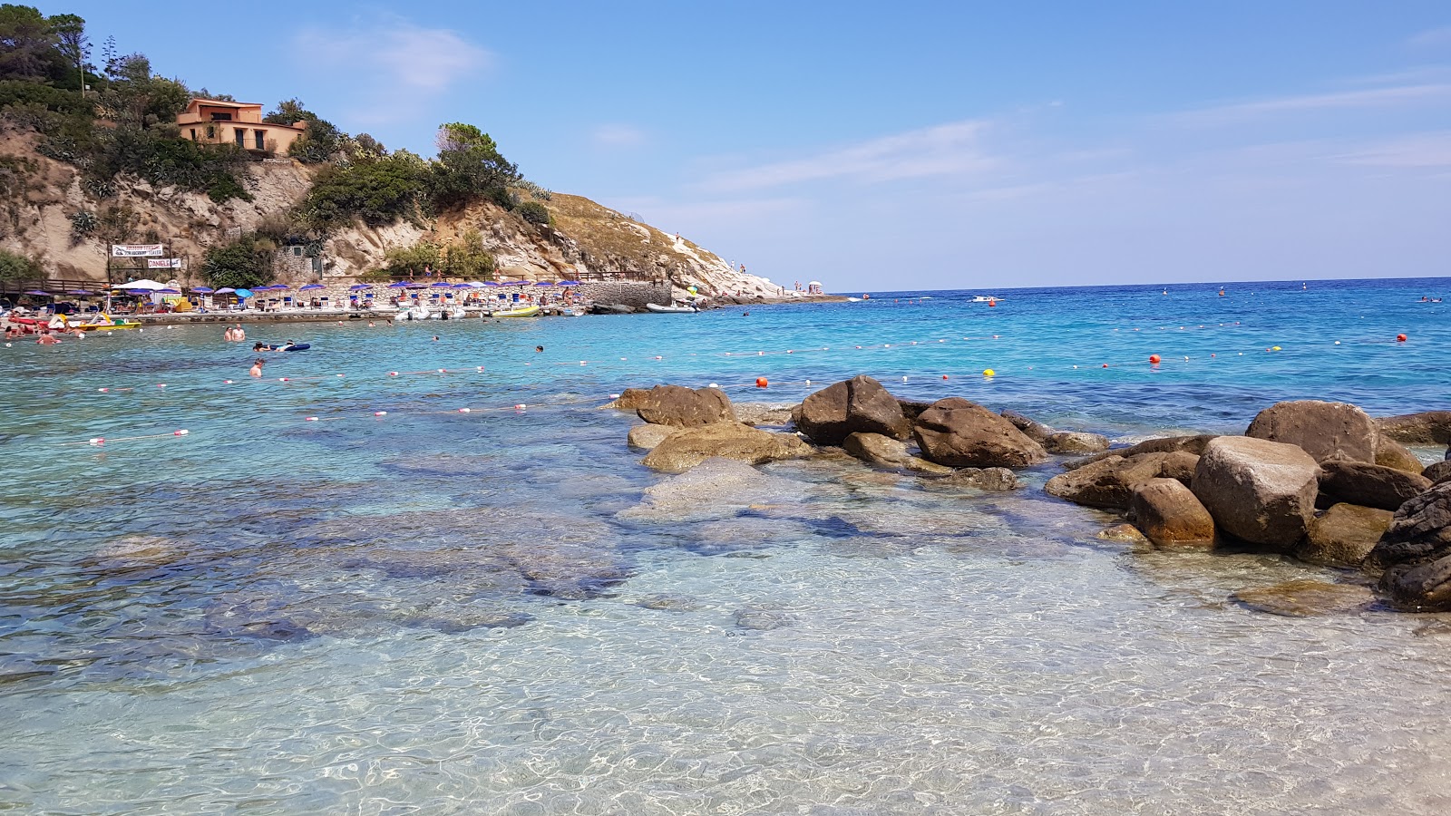 Photo of Sant'Andrea Beach surrounded by mountains