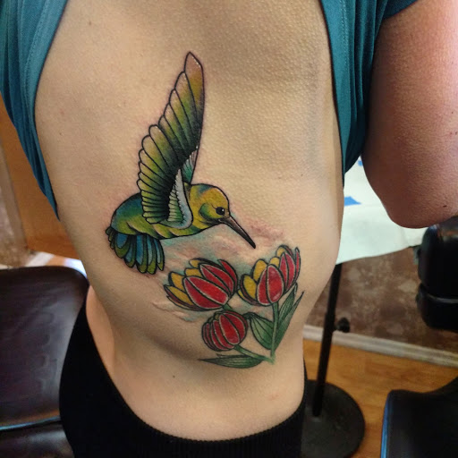 Explore leo tattoo ideas for men, creative tattoo ideas in Ridge, available at Masquerade Tattoo Shop