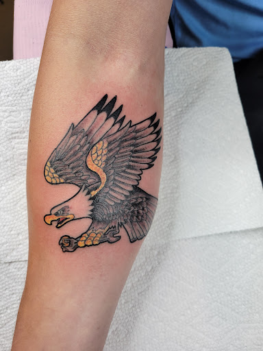 Explore letter tattoo cover up ideas, creative tattoo ideas in Appleton, available at The Wolves Den Tattoo