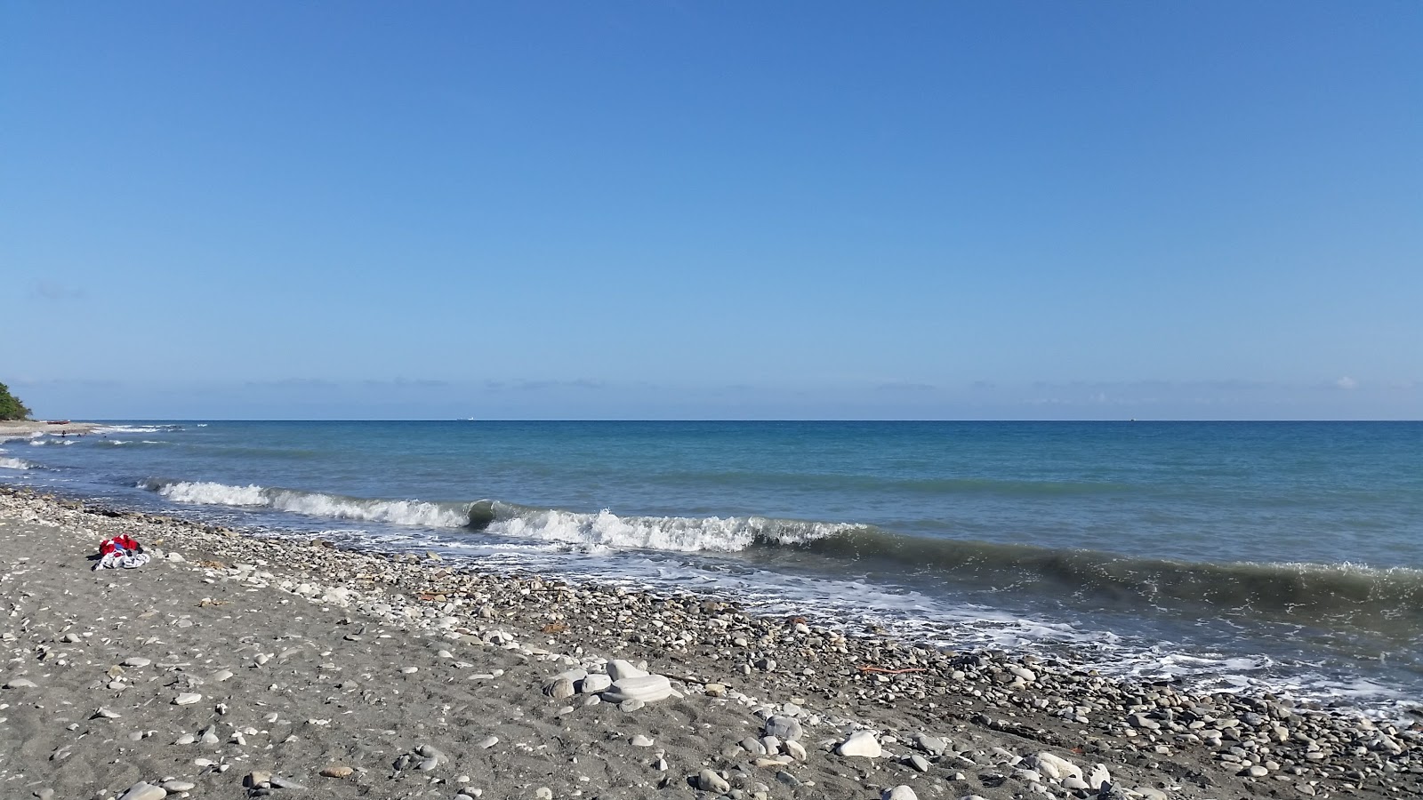 Nizao beach的照片 带有碧绿色水表面