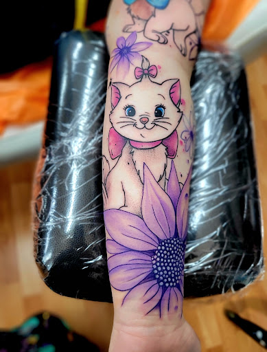 Explore womens sleeve tattoo ideas, creative tattoo ideas in Benton, available at Spectrum Tattoo