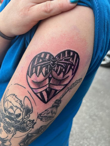 Explore tattoo ideas on belly, creative tattoo ideas in Angola, available at Hoodlum Ink