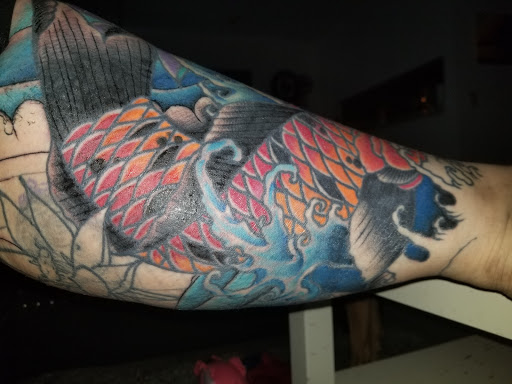 Explore mom and son tattoo ideas, creative tattoo ideas in Orlando, available at Cast Iron Tattoos