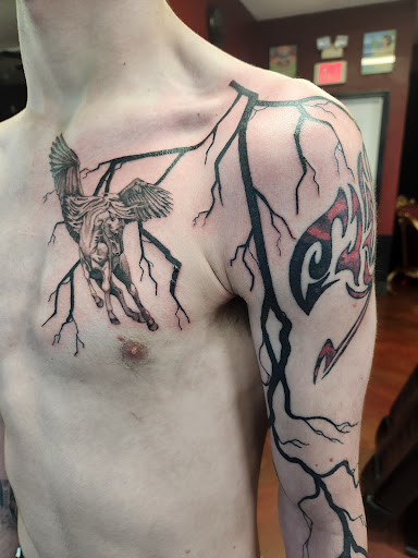 Explore ufc tattoo ideas, creative tattoo ideas in Inverness, available at The Perfect Spot Tattoos