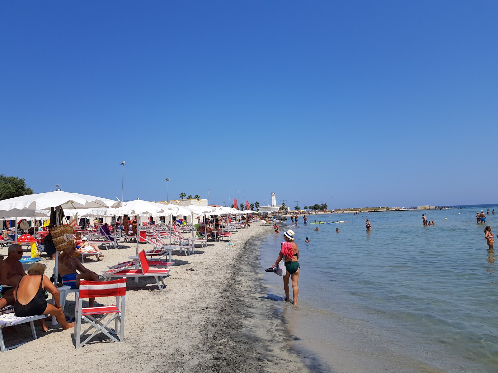 Fotografie cu Lido York cu o suprafață de nisip beige