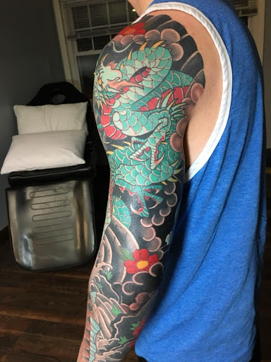 Explore tattoo skull sleeve ideas, creative tattoo ideas in Delmar, available at Resolute Tattoo