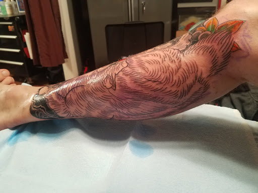 Explore mens hand tattoos ideas, creative tattoo ideas in Omaha, available at Liquid Courage Tattoos