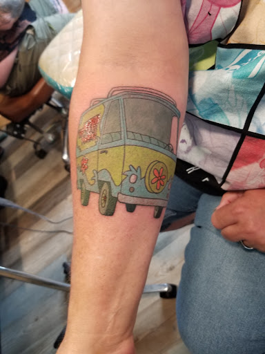 Explore gangster tattoo ideas for men, creative tattoo ideas in Powell, available at Hummingbird Tattoo Studio