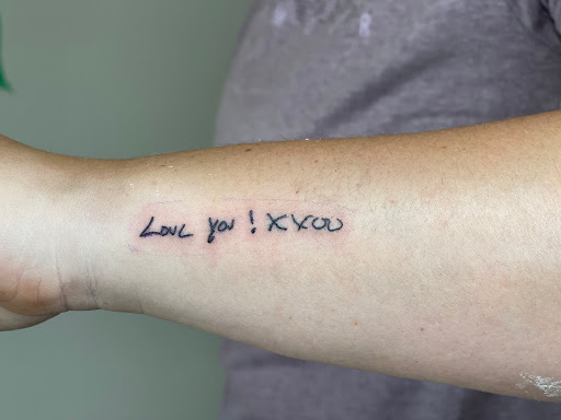 Explore american football tattoo ideas, creative tattoo ideas in Huxley, available at Lonely Bones Tattoo & Art