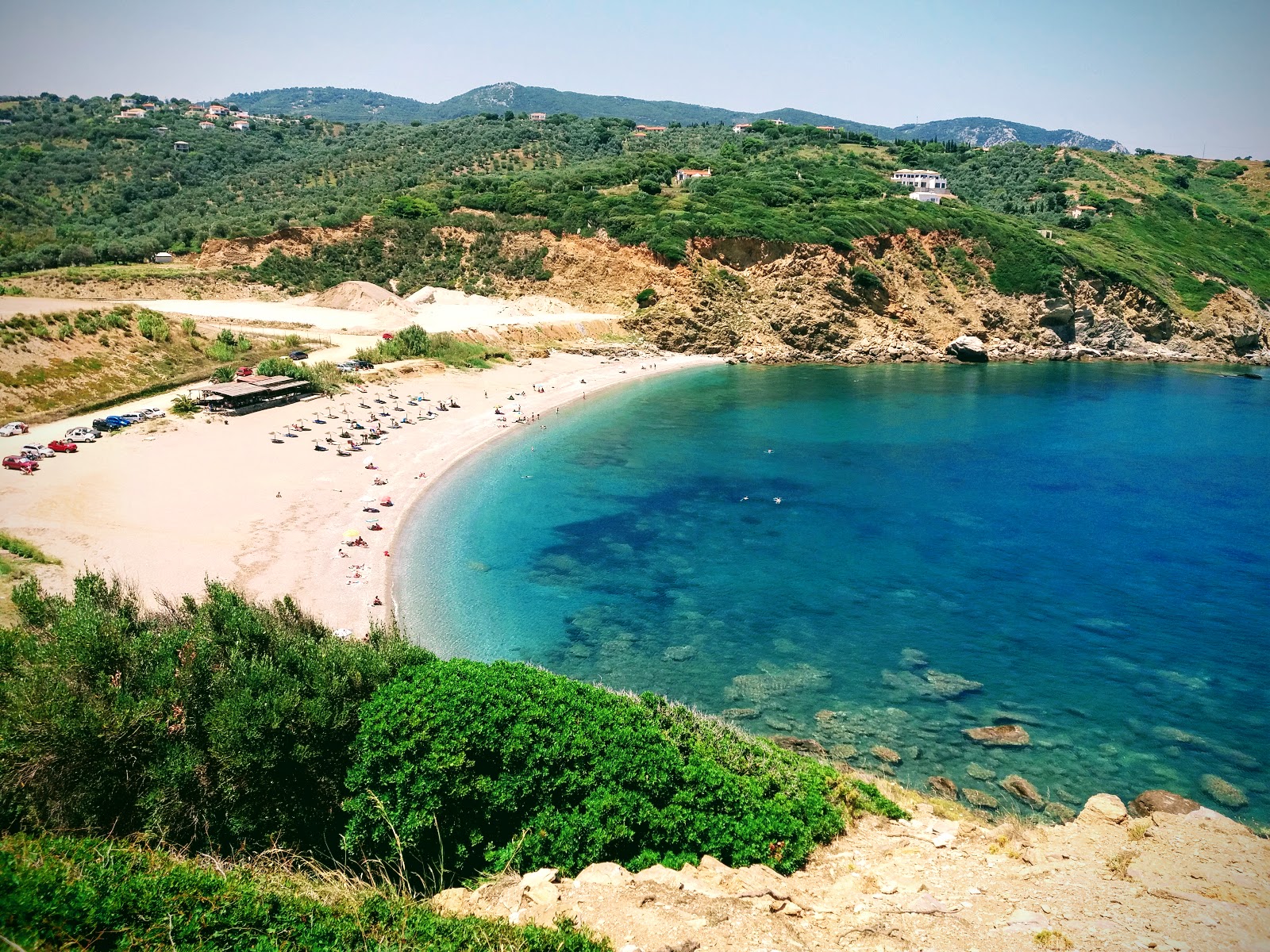 Fotografija Xanemos beach z harmaa hiekka ja kivi površino