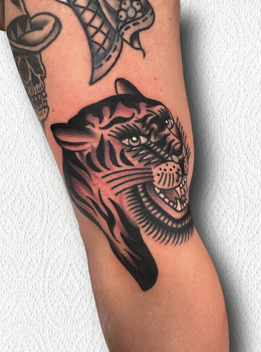 Explore leg tattoos ideas for men, creative tattoo ideas in Johnson City, available at Gold Cross Tattoo Co.