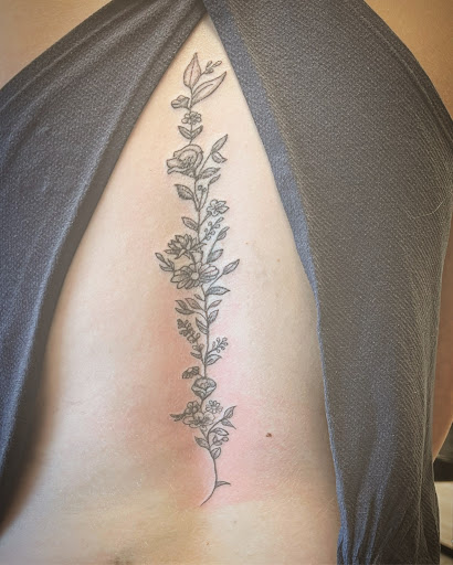 Explore cross with names tattoo ideas, creative tattoo ideas in Cocoa, available at Rorschach Tattoo Shop and Piercing Studio