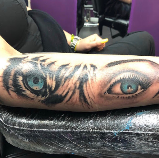 Explore book dragon tattoo ideas, creative tattoo ideas in Miami, available at Tattoos by Lou Miami - North Miami