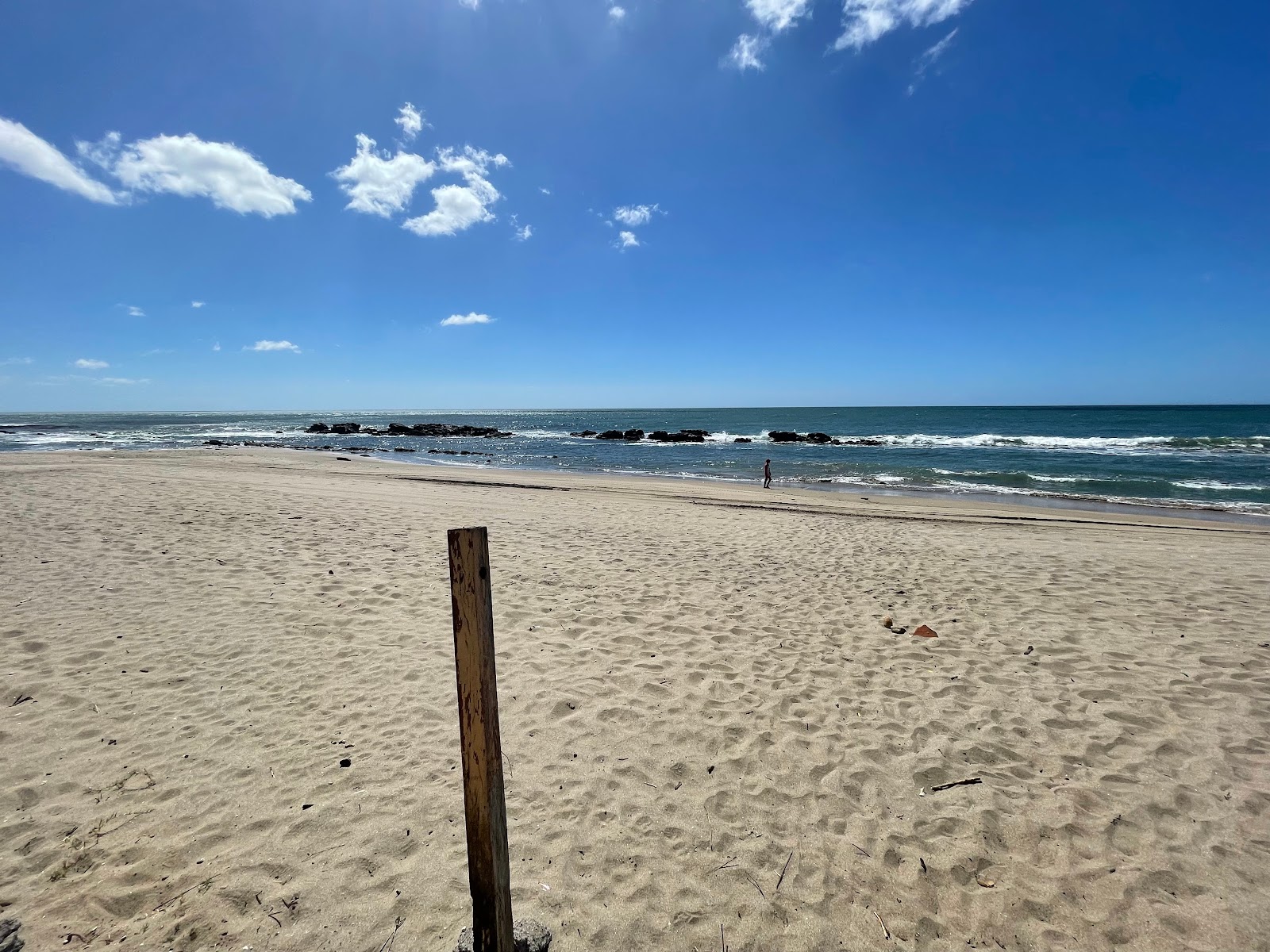 Foto di Playa el Tamarindo con una superficie del sabbia luminosa