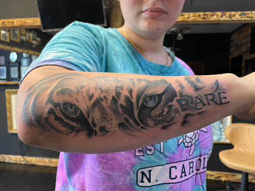 Explore love symbol tattoo ideas, creative tattoo ideas in Wilson, available at Randys Tattoos