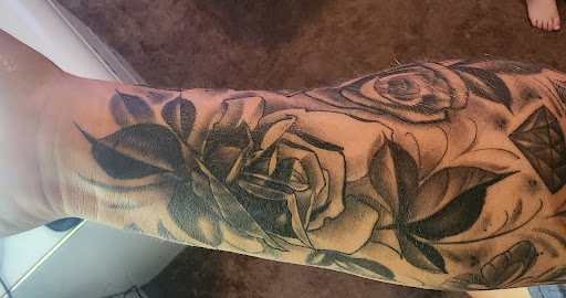 Explore arm flower tattoo ideas, creative tattoo ideas in Eden, available at Slicks Tattoo Studio