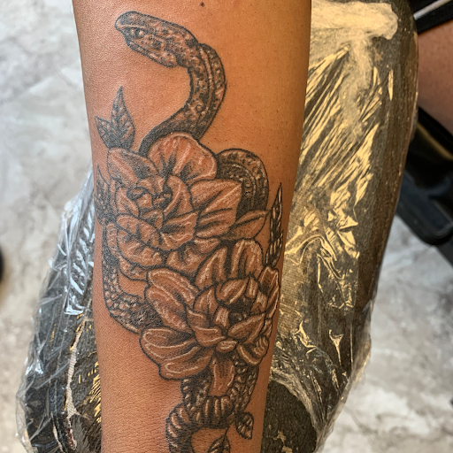 Explore baby footprint tattoo ideas, creative tattoo ideas in Seymour, available at American Gypsy Tattoo Corp.