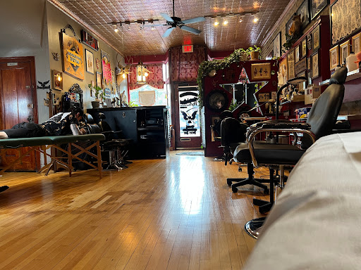 Explore boxing gloves tattoo ideas, creative tattoo ideas in Chicago, available at Revolution Tattoo