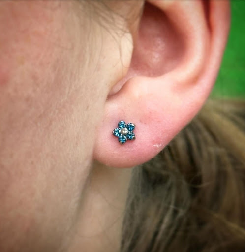 Explore rose tattoo ideas for females, creative tattoo ideas in Abington, available at Tattoo Galaxy (Abington) Piercing and Custom Tattoos