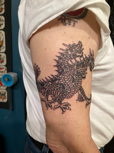 Explore stamp tattoo ideas, creative tattoo ideas in Omaha, available at Liquid Courage Tattoos