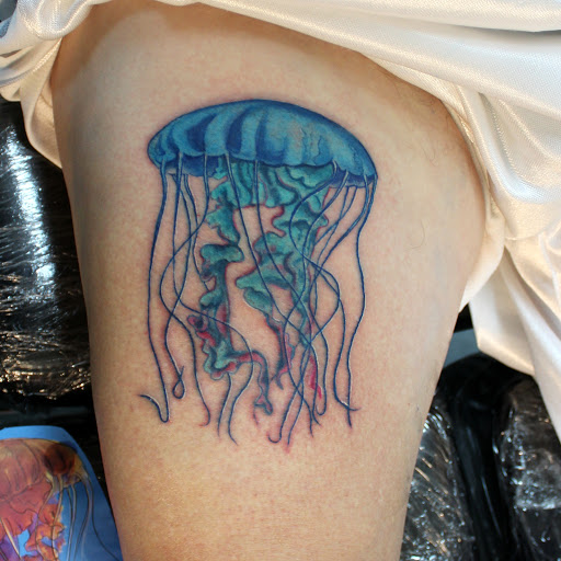 Explore king tattoo ideas, creative tattoo ideas in Fort Myers, available at Tiger Lotus Tattoo and Piercing