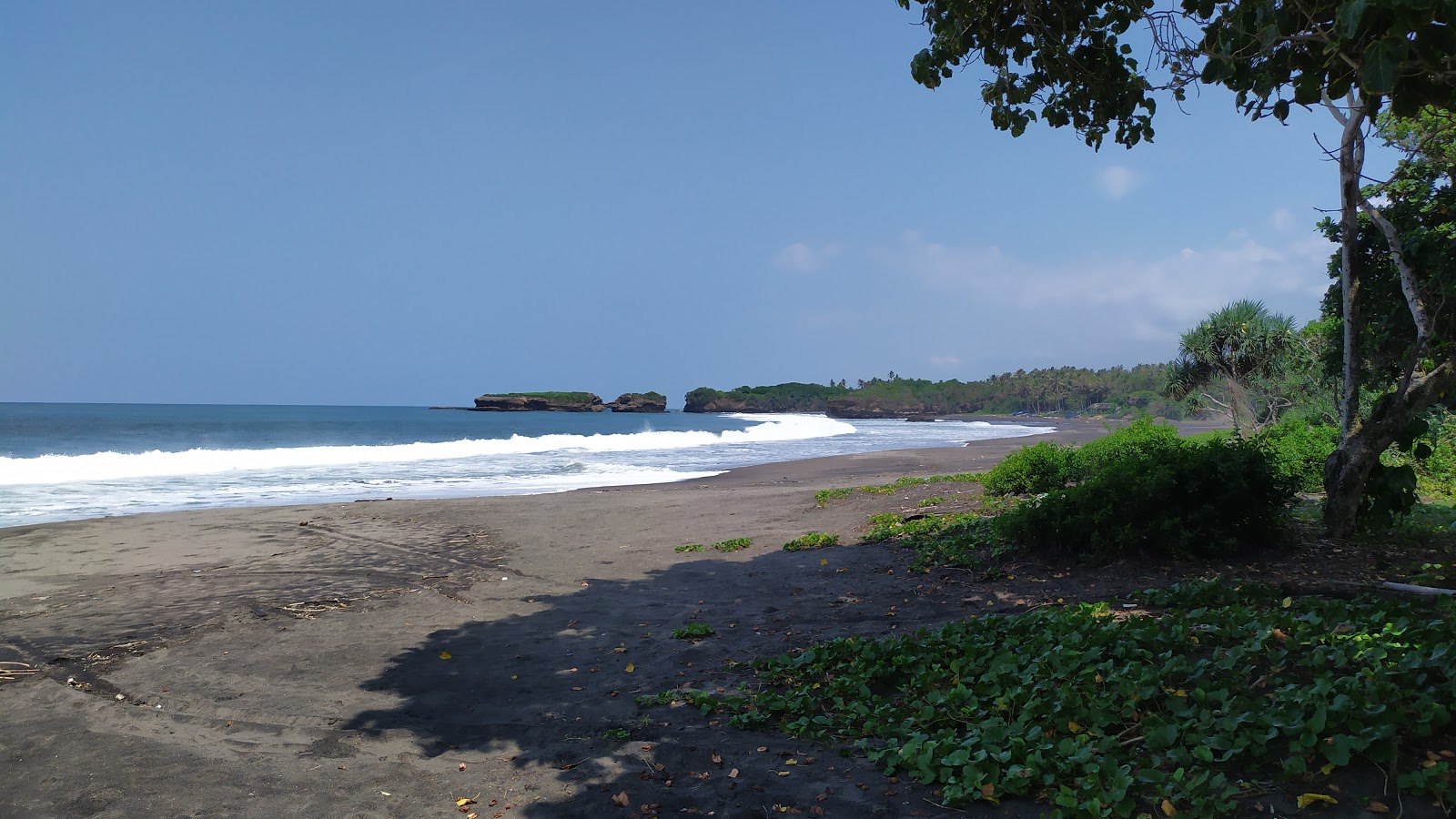 Photo of Kelecung Beach with black sand surface