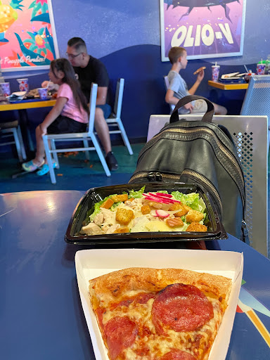 Slice of pepperoni pizza n Cesar salad 
