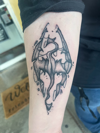 Explore dirtbike tattoo idea, creative tattoo ideas in Cocoa, available at Rorschach Tattoo Shop and Piercing Studio