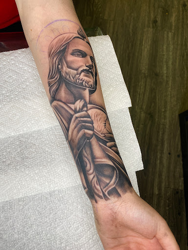Explore male upper arm tattoo ideas, creative tattoo ideas in San Bernardino, available at University tattoo
