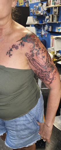 Explore choker tattoo ideas, creative tattoo ideas in Englewood, available at The Original Big Daddy Tattoo & Body Piercing est.1997 est.1997