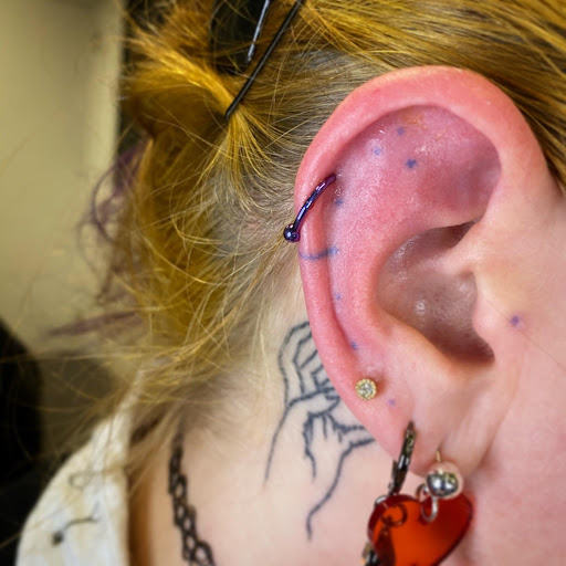 Explore chest plate tattoo ideas, creative tattoo ideas in Louisburg, available at Purple Dot Piercings