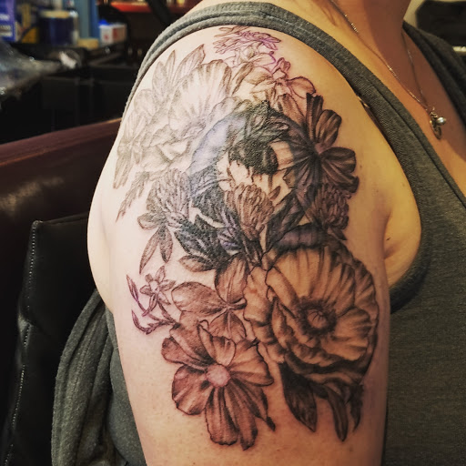 Explore rhea ripley tattoo ideas, creative tattoo ideas in Spokane, available at Moms Custom Tattoo & Body Piercing