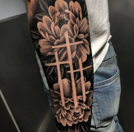 Explore roses tattoo ideas, creative tattoo ideas in San Antonio, available at Platinum Tattoos & Piercings