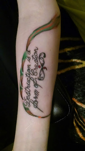 Explore feminine sleeve tattoo ideas, creative tattoo ideas in Hanceville, available at Wildman Tattoo and Body Piercing