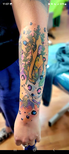 Explore tramp stamp tattoo cover up ideas, creative tattoo ideas in Benton, available at Spectrum Tattoo