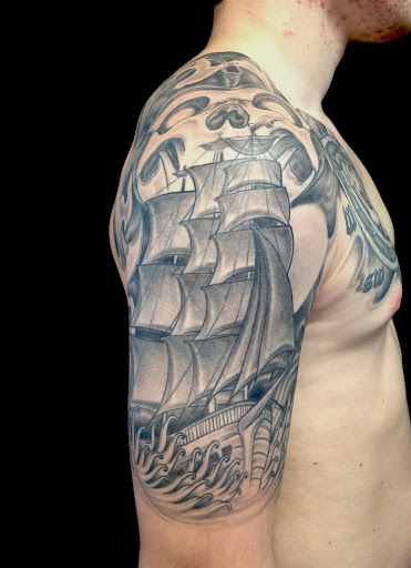 Explore thigh hip tattoo ideas, creative tattoo ideas in Peoria, available at Iron Key Tattoo Studio Inc.