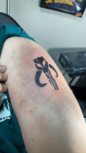 Explore american football tattoo ideas, creative tattoo ideas in Elizabeth City, available at Julius Star Tattoo Gallery