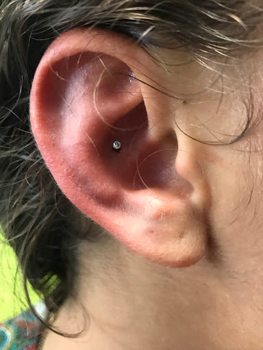 Explore flag tattoo ideas, creative tattoo ideas in Atlanta, available at Iron Palm Tattoos & Body Piercing Atlanta