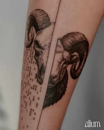 Find in between boob tattoo ideas for your next unique tattoo in Culver City at Alium Tattoo Studio