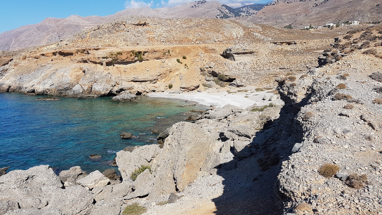 Photo of Ammoudi beach with gray pebble surface