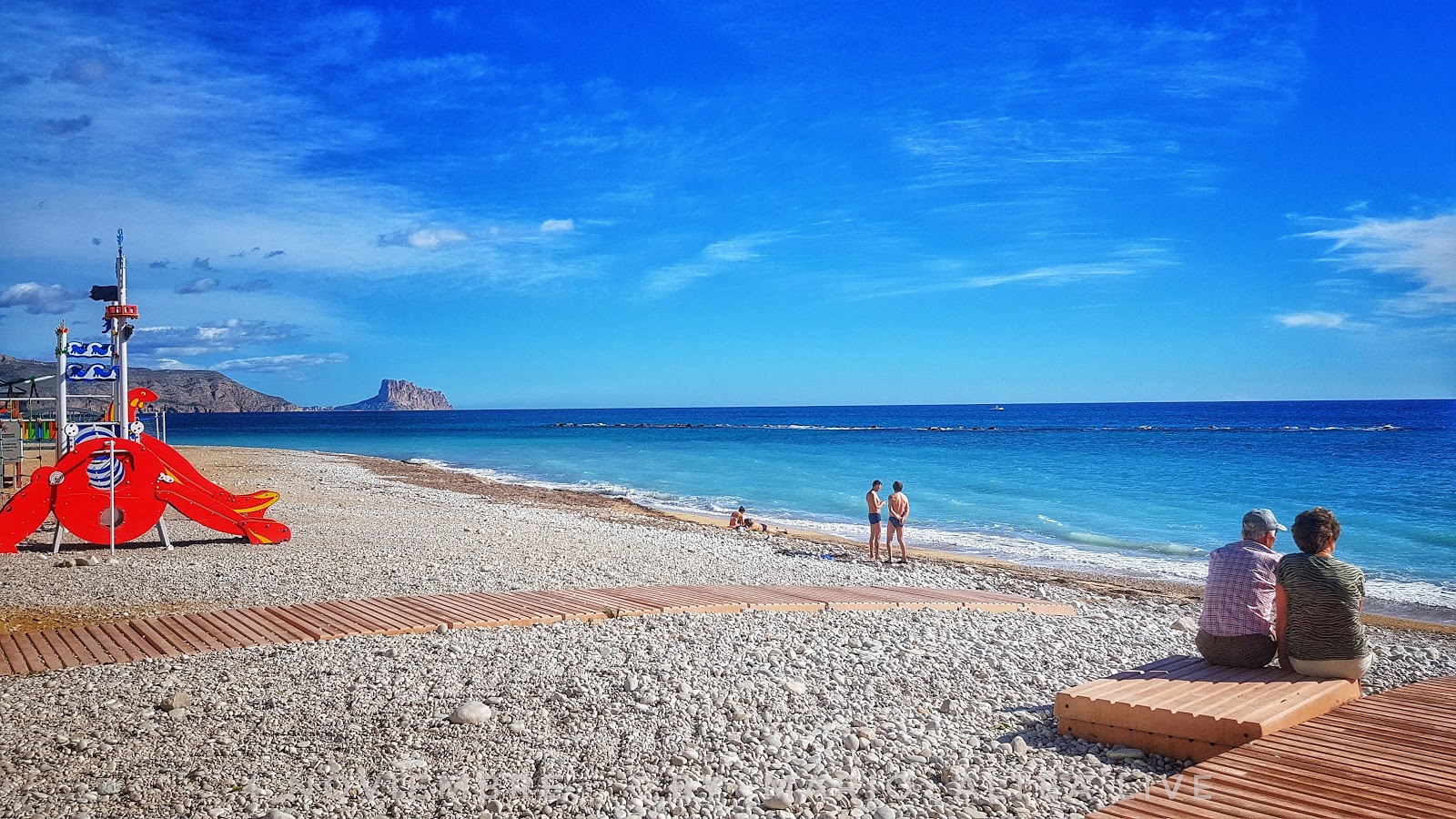 Foto av Playa la Roda med blå rent vatten yta