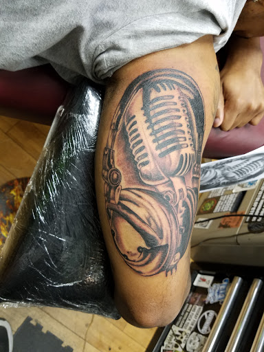 Explore half sleeve tattoo ideas for guys, creative tattoo ideas in Burlington, available at Mr Tattoos & Piercing