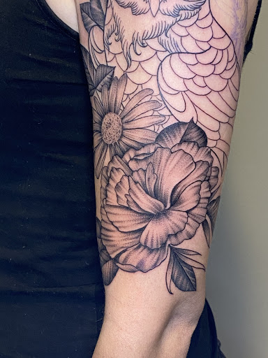 Explore half sleeve tribal tattoo ideas, creative tattoo ideas in Amherst, available at Wanderlust Tattoo & Piercing