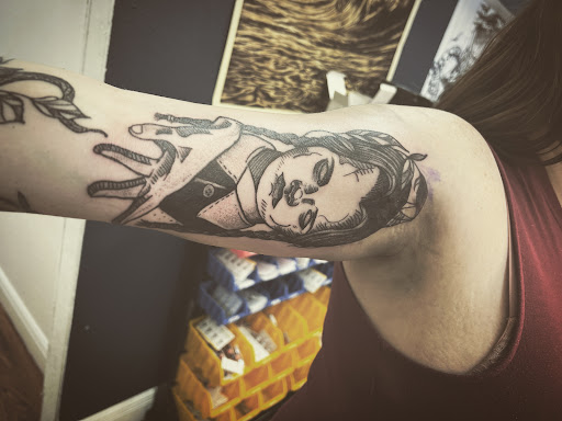 Explore aunty tattoo ideas, creative tattoo ideas in Cocoa, available at Rorschach Tattoo Shop and Piercing Studio