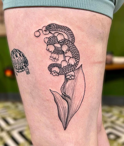 Explore tombstone movie tattoo ideas, creative tattoo ideas in Bloomington, available at Crystal Moon Body Arts