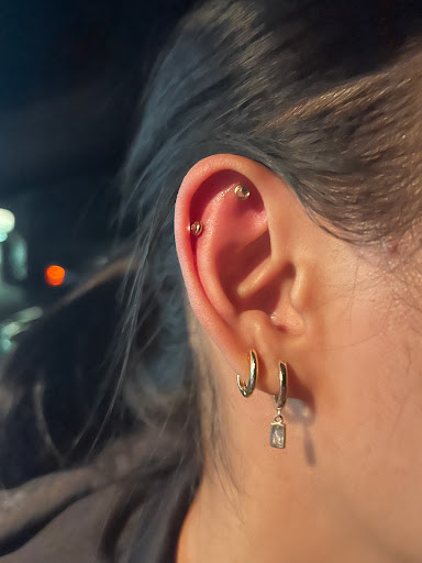 Explore skier tattoo ideas, creative tattoo ideas in Orange, available at Symbiosis Body Piercing